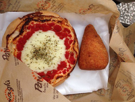 Mini pizza and arancino – a rice ball filled with sauce and cheese from Panaglu in Catania