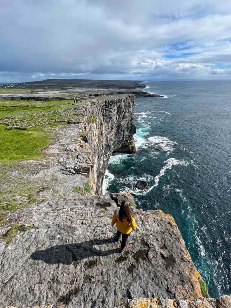 Amanda standing on the Dún Aonghasa cliffs