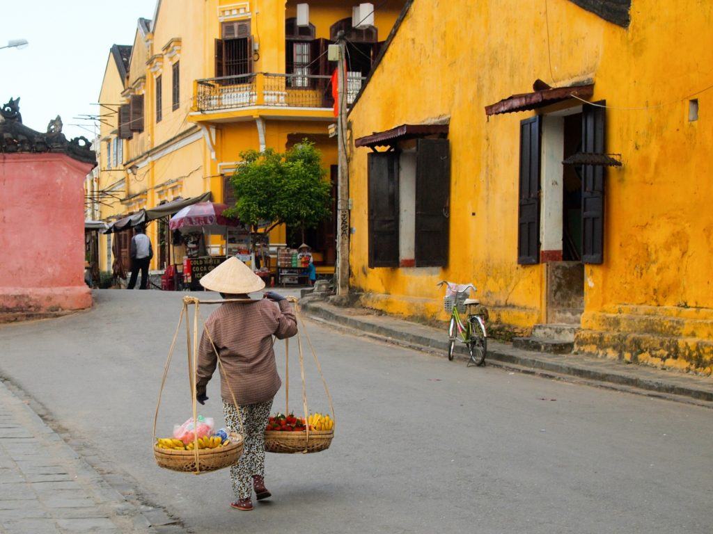 Woman carrying baskets in Hoi An, Vietnam