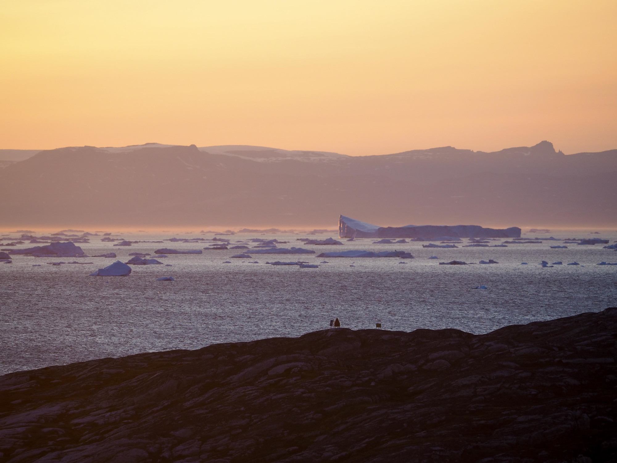 Sunset over icebergs in Greenland