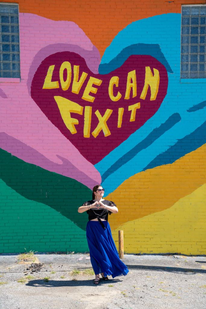 Amanda at a Love Can Fix It mural
