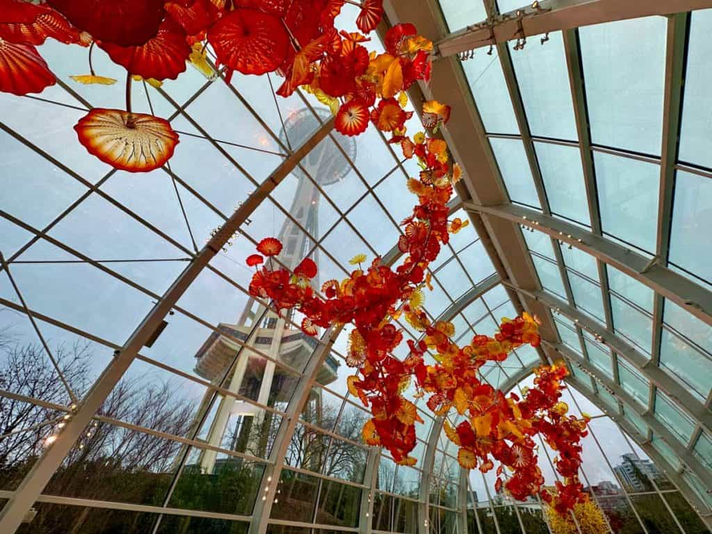 Chihuly Gardens and Glass glasshouse with a view of the Space Needle