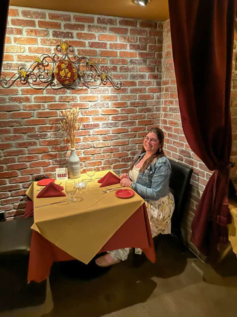 Amanda in a dining nook at Marcellino Ristorante