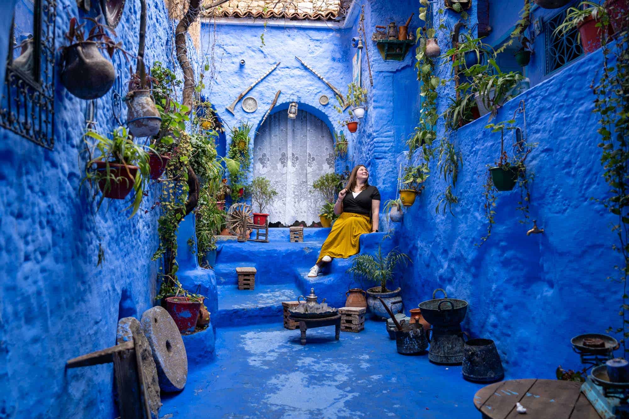 Amanda in a blue courtyard in Chefchaouen | Things to know about visiting Chefchaouen