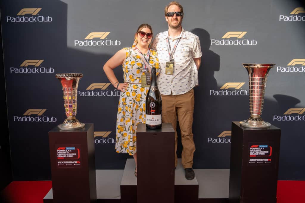 Amanda and Elliot with championship trophies in the Paddock Club in Austin