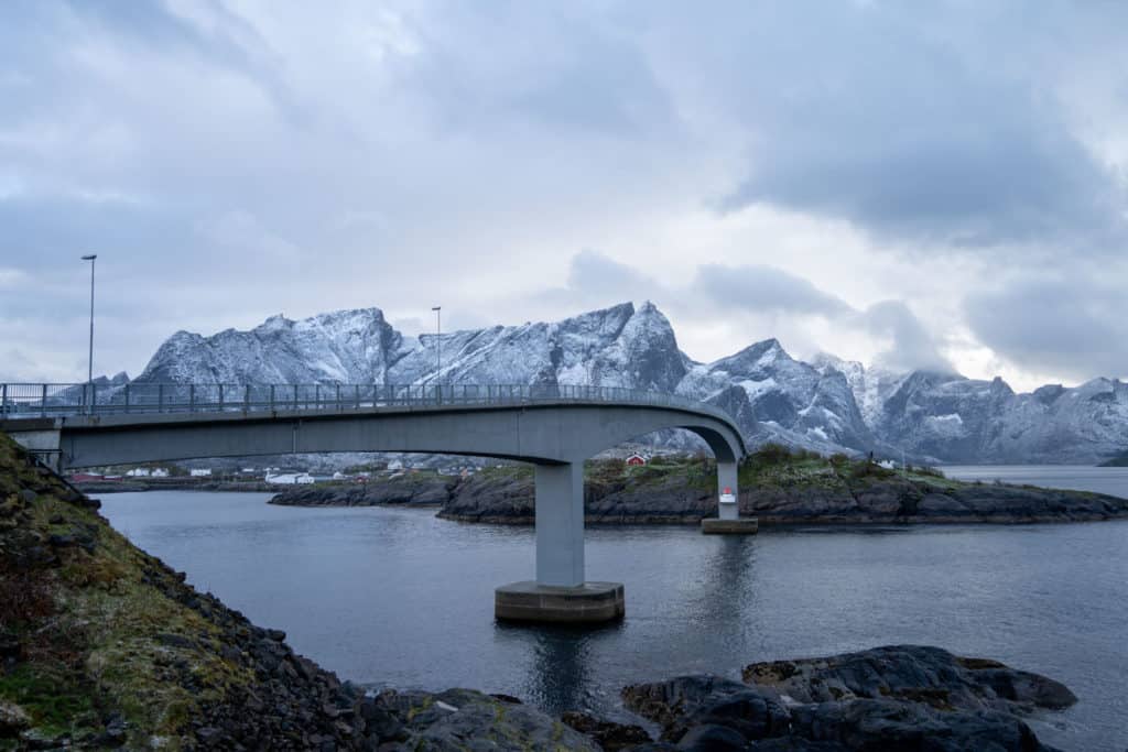 Hamnoy bridge with snowy mountains in the background