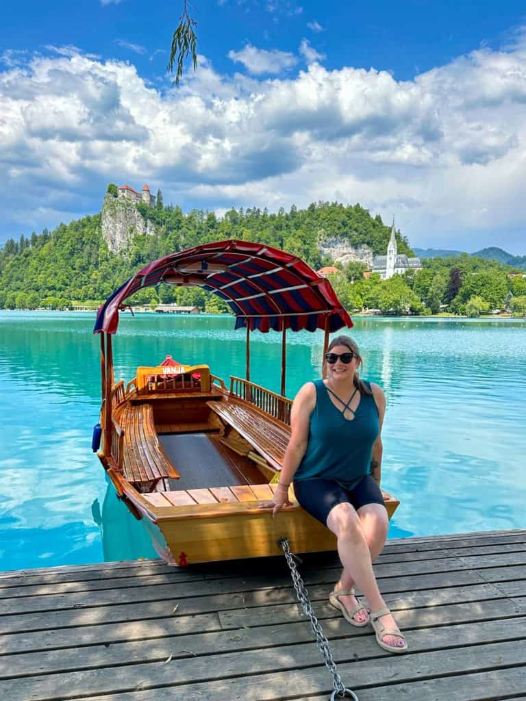 Amanda at Lake Bled sitting on a wooden pletna boat