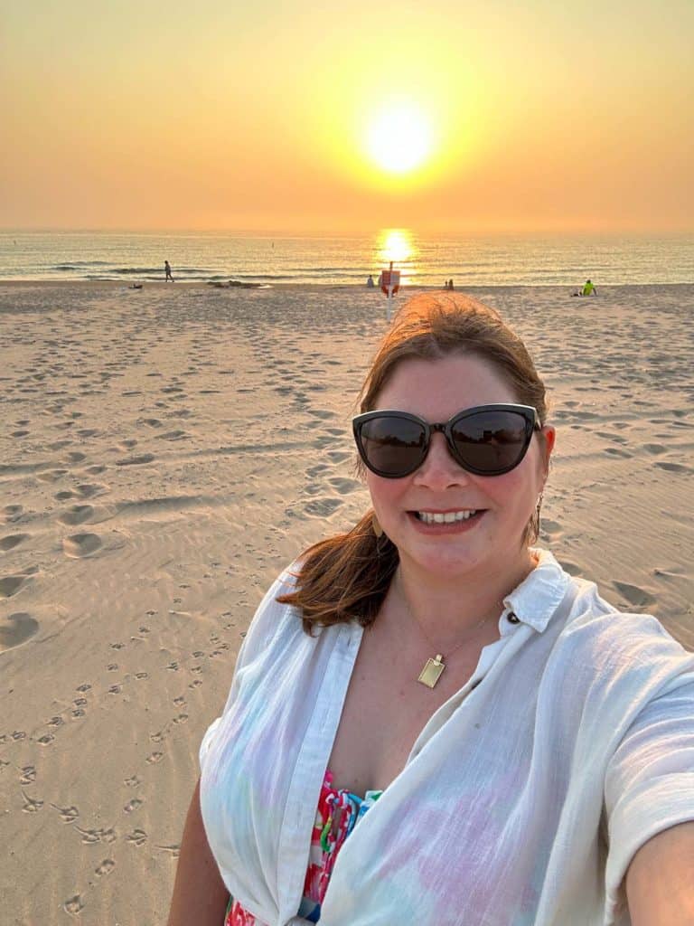 Amanda on a beach at sunset