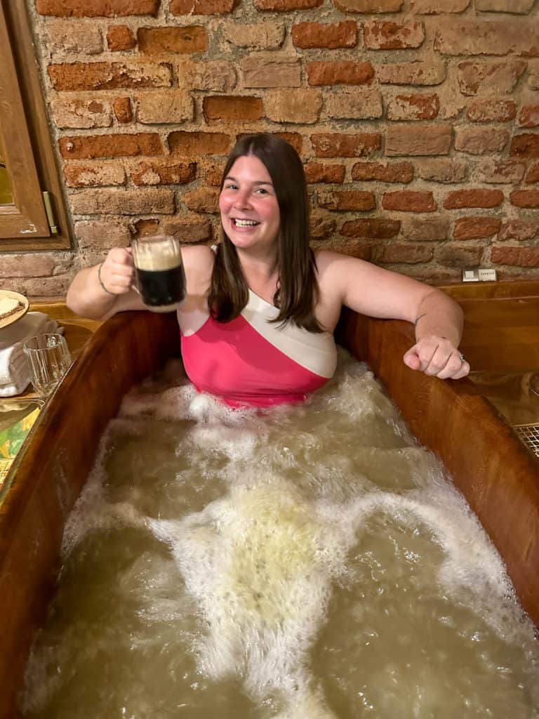 Amanda smiling in a beer hot tub