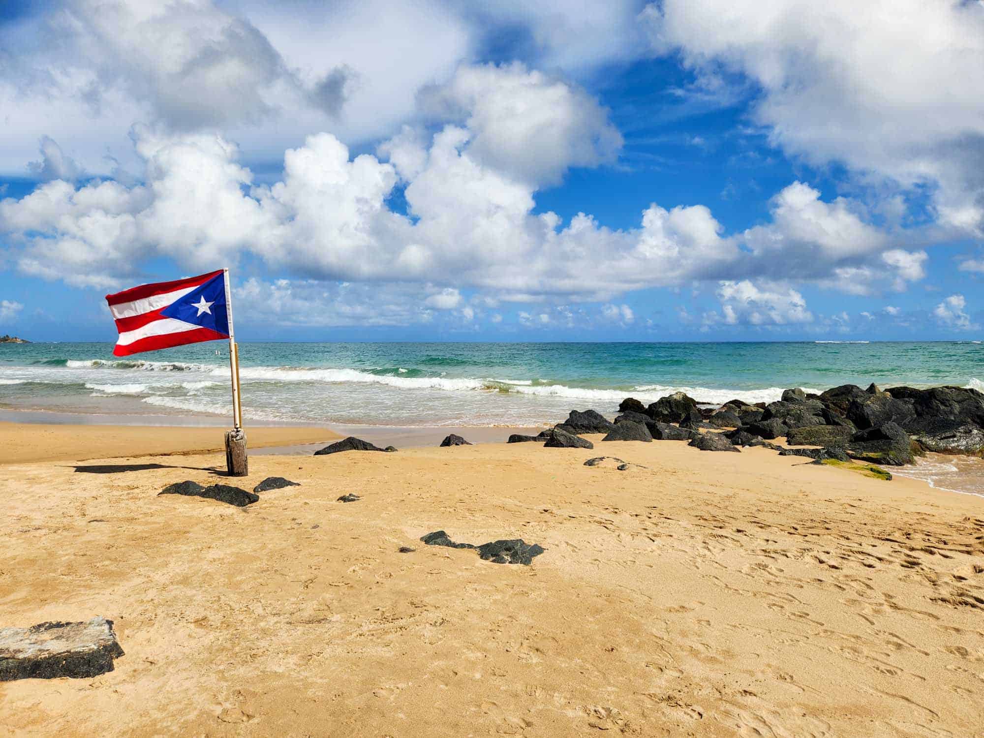 Puerto Rican flag on a beach