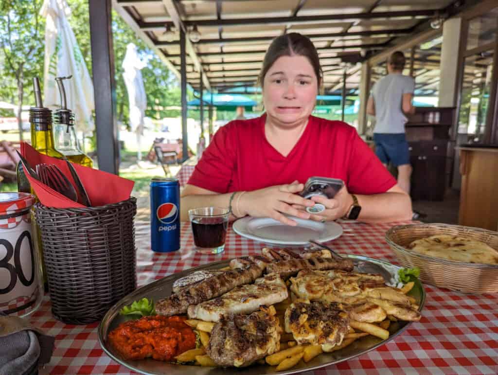 Amanda making a face at a huge meat platter